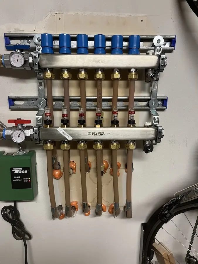 Plumber performing Water Heater Repair at a residential property in Johnson